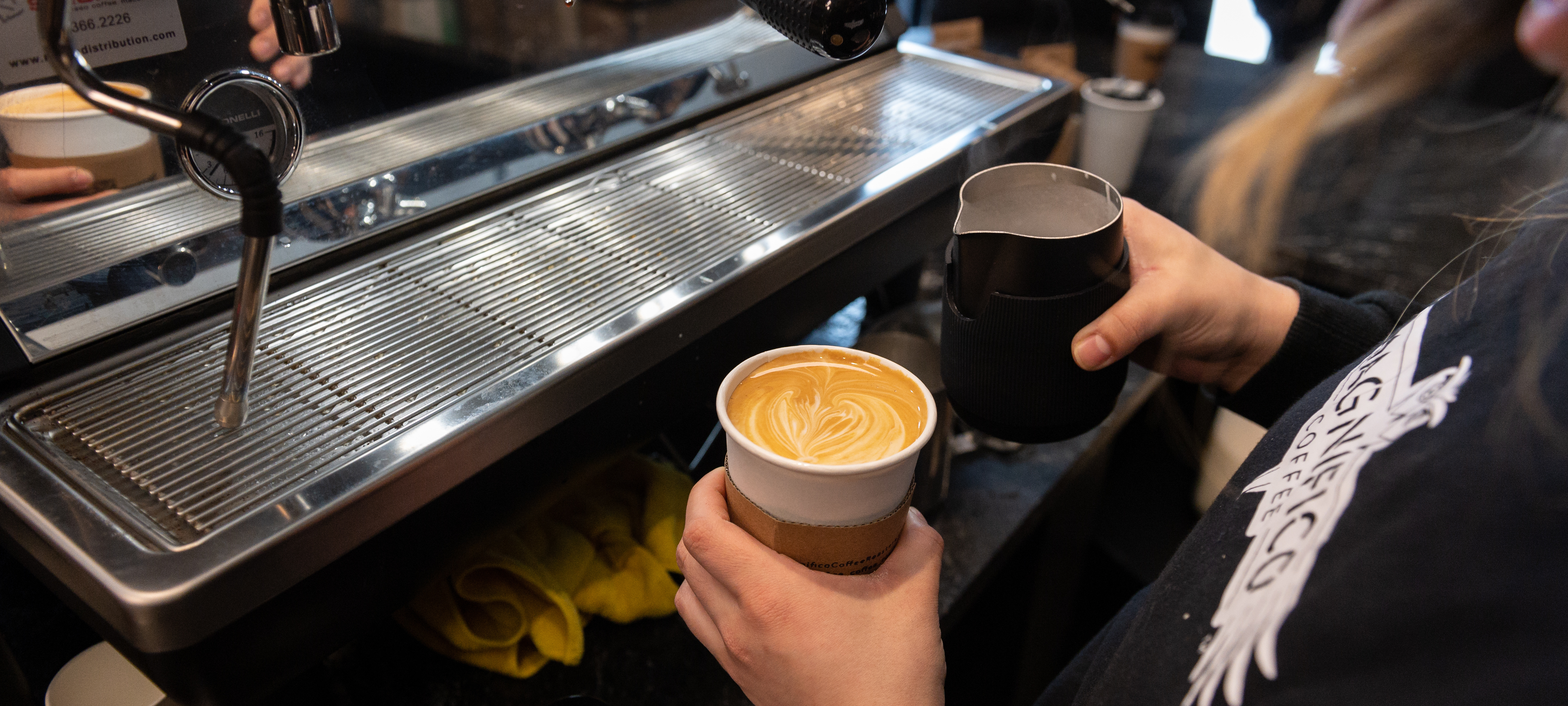 Latte being served at Magnifico Coffee